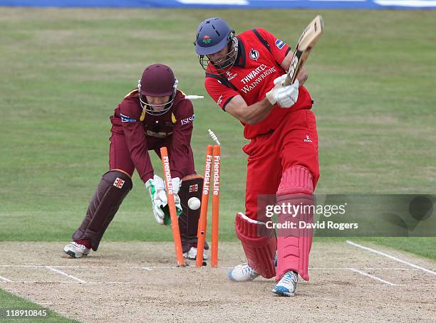 Sajid Mahmood of Lancashire is bowled by Andrew Hall during the Friends Life T20 match between Northamptonshire and Lancashire at the County Ground...
