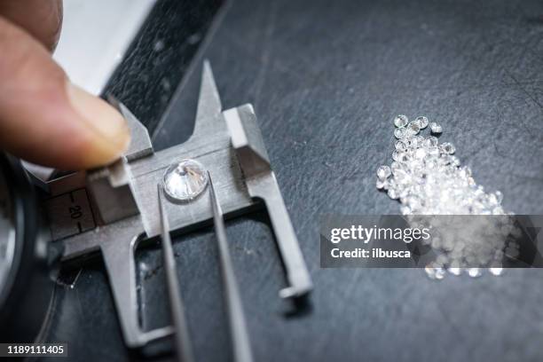 professional gemstone settings jewellery craft laboratory: choosing diamonds - diamond jeweller stock pictures, royalty-free photos & images