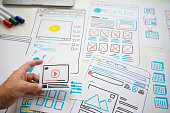 Designer planning draft sketch in design studio.
