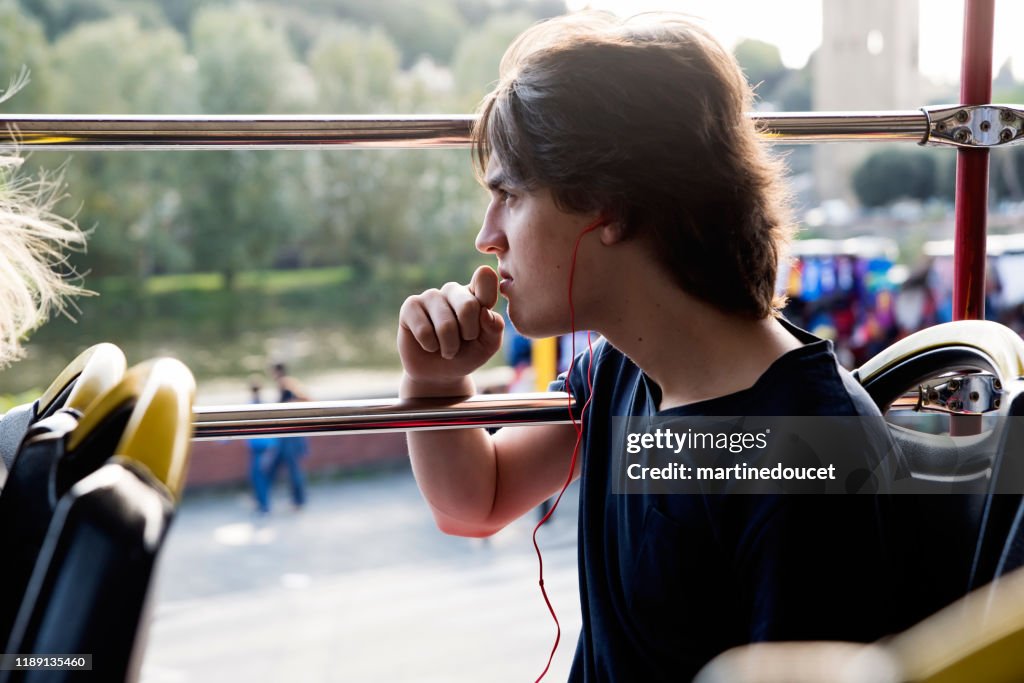 Teenage boy on a tour bus visiting Florence, Italy.