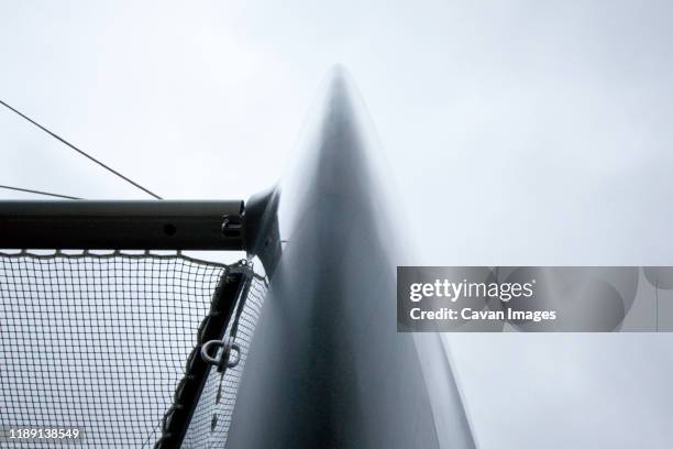 view from below under the bow of the port side of a cruising catamaran - clit stock pictures, royalty-free photos & images