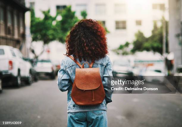 go where the heart leads you - woman rucksack stock pictures, royalty-free photos & images