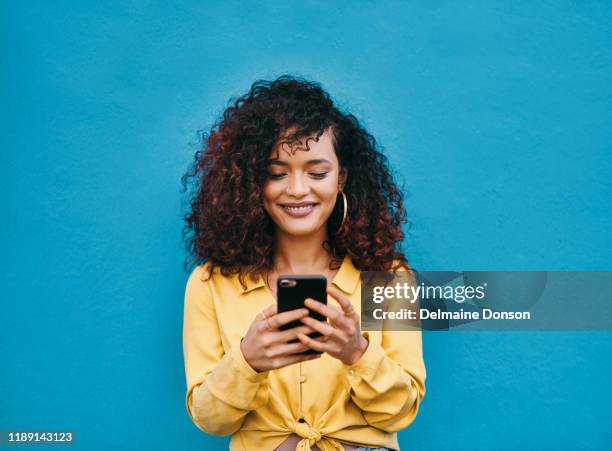 i'm loving how this conversation is going - woman texting stock pictures, royalty-free photos & images