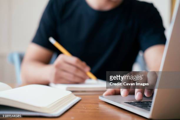 closeup man hands using computer laptop. - examination closeup stockfoto's en -beelden