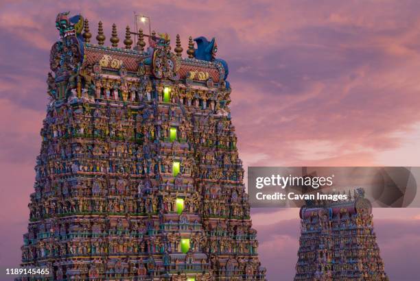 meenakshi temple lights turns on during dazzling twilight - sri meenakshi hindu temple stock pictures, royalty-free photos & images