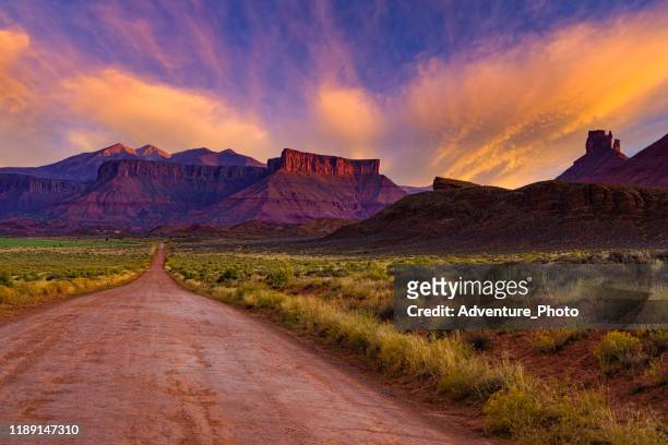 la sal mountains and red rock canyons sunset - utah road stock pictures, royalty-free photos & images