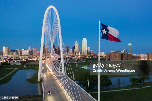 elevated view of the margaret hunt bridge and the dallas skyline at dusk - texas flag stock pictures, royalty-free photos & images