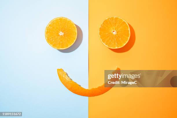 happy orange - smiley face stock-fotos und bilder