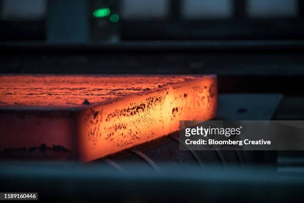 hot steel in a steel factory - molten fotografías e imágenes de stock