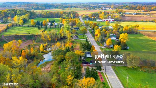 scenic small town nestled amid fertile valley in beautiful rural wisconsin - rural scene stock pictures, royalty-free photos & images