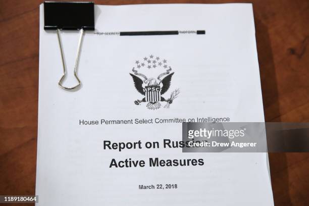 Copy of a report on Russian Active Measures to interfere with U.S. Elections is shown during a hearing where Fiona Hill, the National Security...