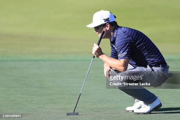 Zach Johnson of the United States lines up a putt on the tenth green during the first round of the RSM Classic on the Plantation course at Sea Island...