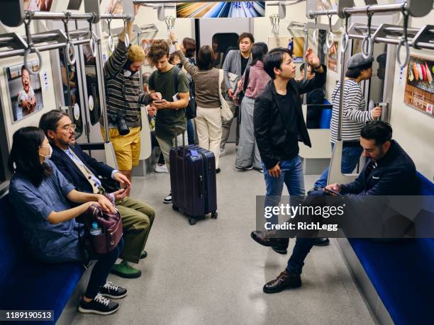 crowded japanese subway train - kanto region stock pictures, royalty-free photos & images