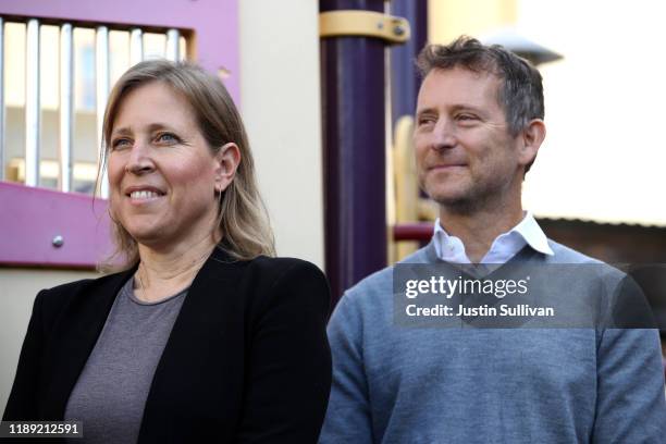 YouTube CEO Susan Wojcicki stands with her husband Dennis Troper during a press conference at Hamilton Families on November 21, 2019 in San...