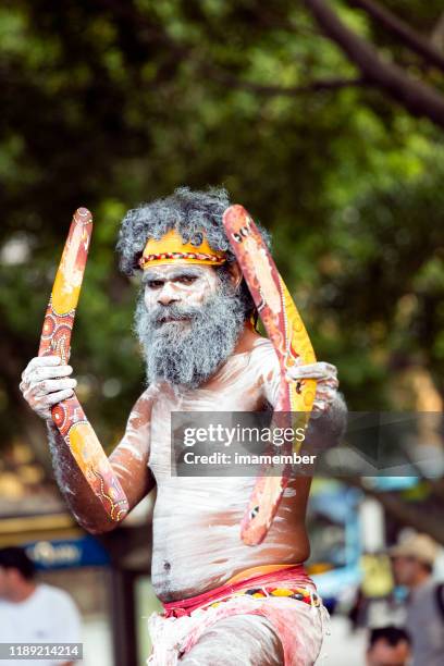 aboriginal male dancing with boomerangs, sydney australia, copy space - traditional ceremony stock pictures, royalty-free photos & images