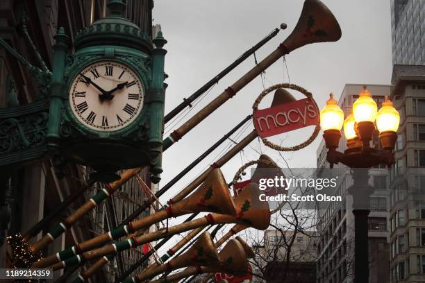 Holiday decorations hong outside of a Macy's store downtown on November 21, 2019 in Chicago, Illinois. Macy’s Inc. Reported a drop in third quarter...