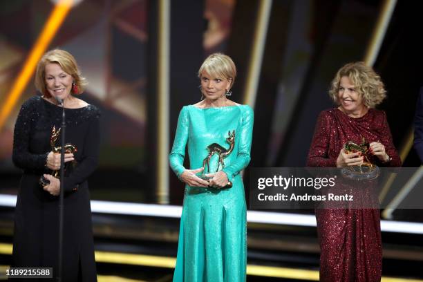 Award winners Gaby Dohm, Uschi Glas and Michaela May pose on stage during the 71st Bambi Awards show at Festspielhaus Baden-Baden on November 21,...