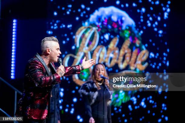 Robbie Williams performs on the eve of the release of his album ‘The Christmas Present’ at The Bavarian Hut stage during Winter Wonderland 2019 at...