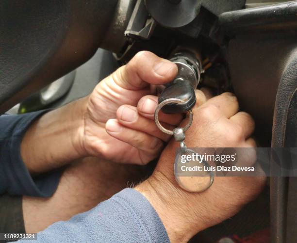 mechanic repairing on start of the car - turning key stock pictures, royalty-free photos & images