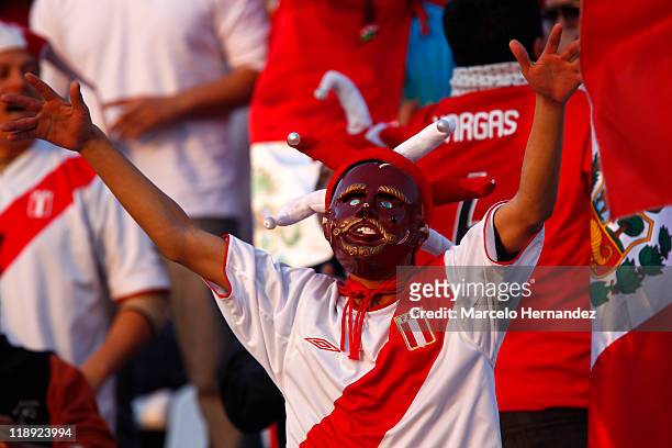 Peruvian fans cheer to their team during the soccer game against Peru as part of group C of 2011 Copa America at Malvinas Argentinas Stadium on July...