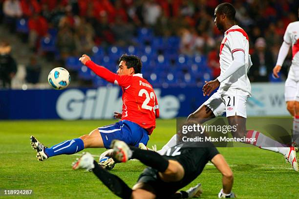 Esteban Paredes of Chile battles for the ball against Christian Ramos of Peru during a match as part of group C of 2011 Copa America at Malvinas...