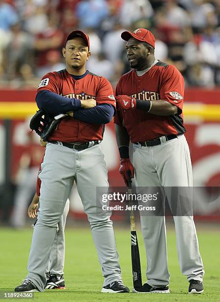 American League All-Star Miguel Cabrera of the Detroit Tigers stands with American League All-Star David Ortiz of the Boston Red Sox during batting...