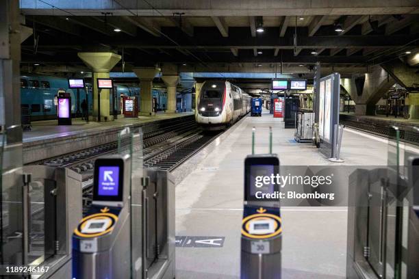 High speed train arrives during a nation-wide transport workers strike at Montparnasse railway station, operated by Societe Nationale des Chemins de...