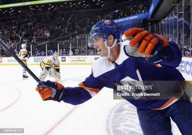 Brock Nelson of the New York Islanders scores the game winning goal at 4:16 of overtime against the Pittsburgh Penguins at the Barclays Center on...