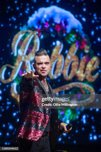 Robbie Williams performs on the eve of the release of his album ‘The Christmas Present’ at The Bavarian Hut stage during Winter Wonderland 2019 at...