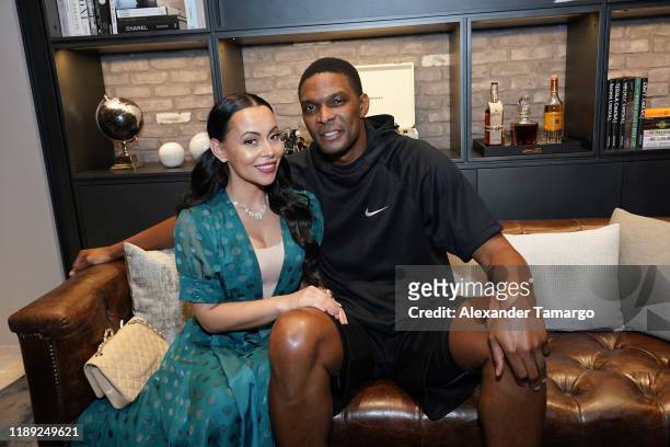 Adrienne Bosh and Chris Bosh attend the Breitling Boutique Miami Grand Opening Event With Breitling Ambassador Scott Kelly on November 21, 2019 in...