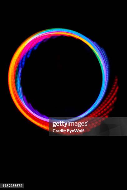 a led hula hoop with different colors in a perfect circle. - リング ストックフォトと画像