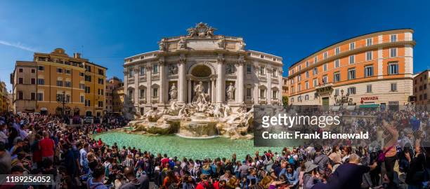 Panoramic view of the Trevi Fountain, Fontana di Trevi, visited by hundreds of people.