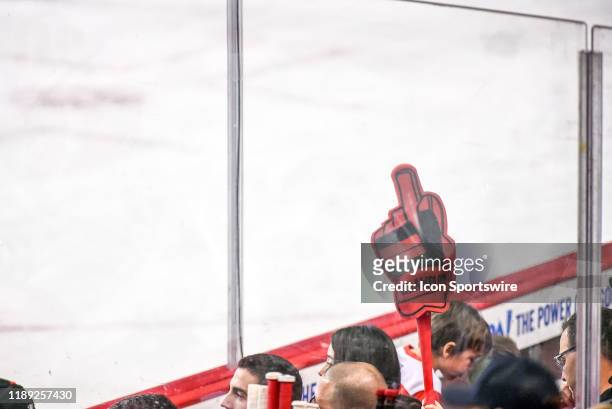 Calgary Flames fan holds a foam finger in the air during the third period of an NHL game where the Calgary Flames hosted the Carolina Hurricanes on...