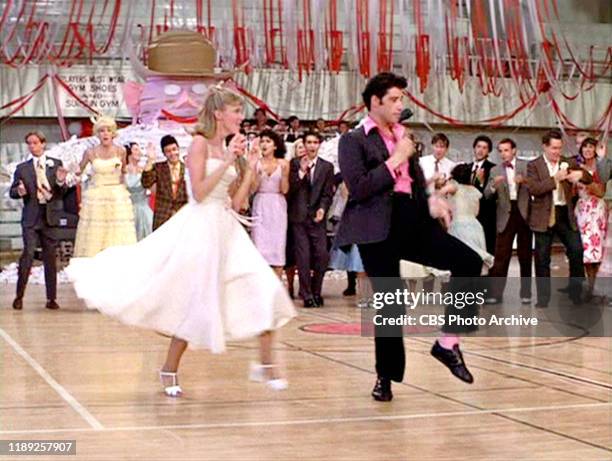 The movie "Grease", directed by Randal Kleiser. Seen here at high school dance Olivia Newton-John as Sandy and John Travolta as Danny Zuko. Initial...