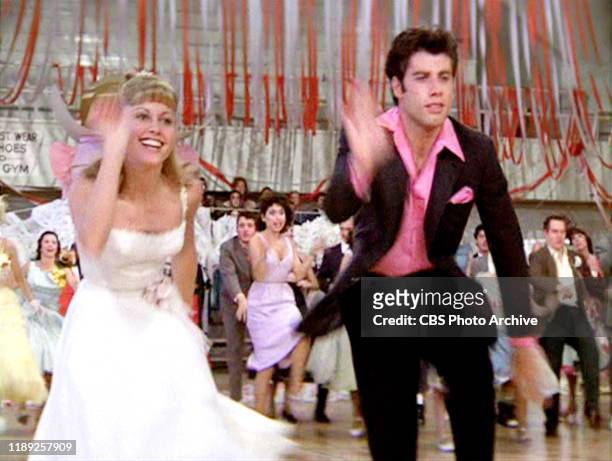 The movie "Grease", directed by Randal Kleiser. Seen here at high school dance Olivia Newton-John as Sandy and John Travolta as Danny Zuko. Initial...