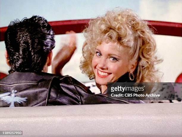 The movie "Grease", directed by Randal Kleiser. Seen here, Olivia Newton-John as Sandy, waves goodbye. Initial theatrical release of the film, June...