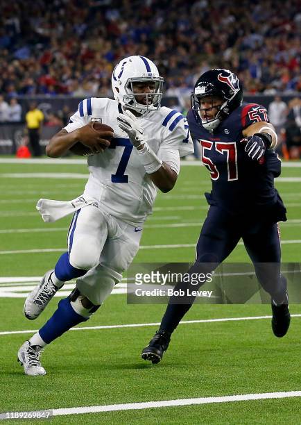 Quarterback Jacoby Brissett of the Indianapolis Colts celebrates rushing for a touchdown during the second quarter of the game against the outside...
