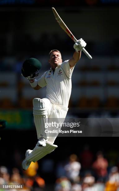 David Warner of Australia celebrates after reaching his century during day two of the 1st Domain Test between Australia and Pakistan at The Gabba on...