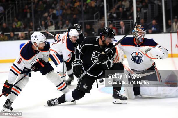 Adam Larsson and Mikko Koskinen of the Edmonton Oilers defend against Anze Kopitar of the Los Angeles Kings during the second period of a game at...