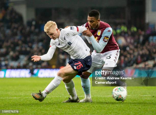 Liverpool's Luis Longstaff competing with Aston Villa's Ezri Konsa during the Carabao Cup Quarter Final match between Aston Villa and Liverpool FC at...