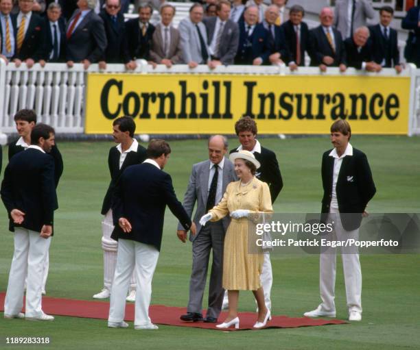 The Queen is introduced to England captain Mike Gatting by MCC President Jack Davies during the teams presentation in the 1st Test match between...