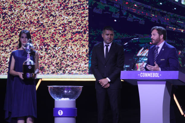 President of CONMEBOL Alejandro Dominguez speaks before delivering a Copa Libertadores Trophy replica to former player and current second Vice...