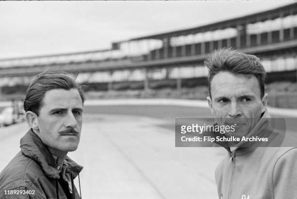 American motor racing driver Dan Gurney, right, and English driver Graham Hill in Indy during the first testing of the Lotus-Ford race car, March...