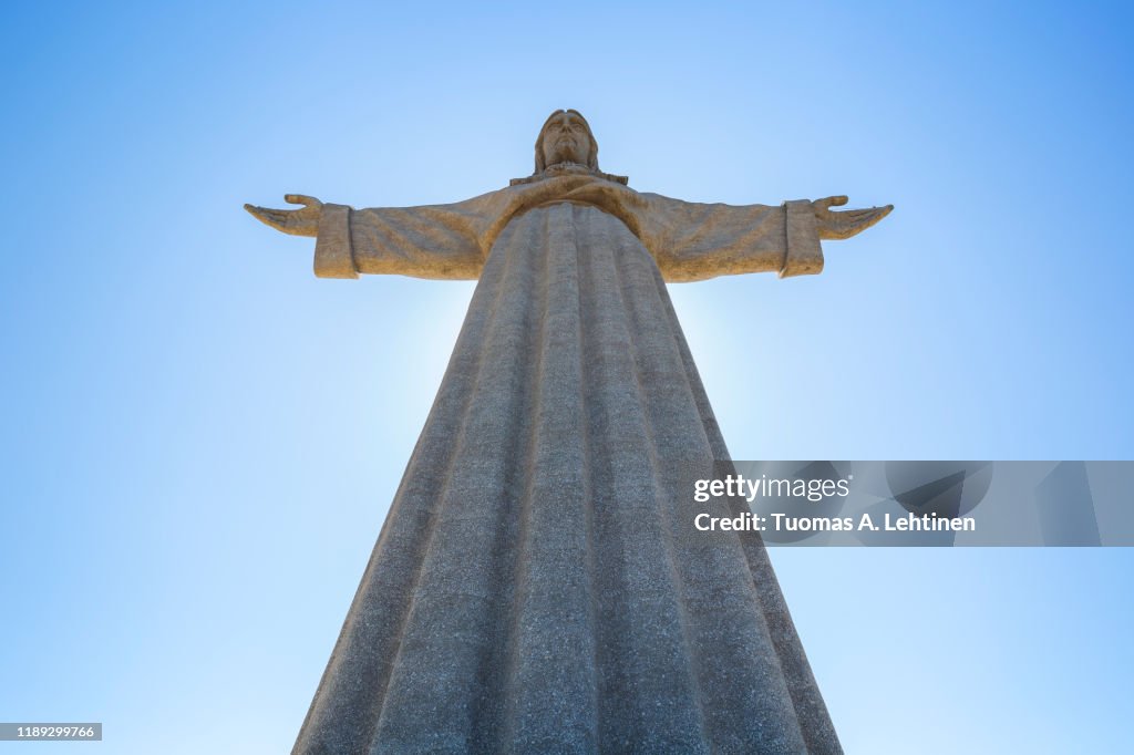 Low angle view of the Sanctuary of Christ the King (Santuario de Cristo Rei). It is a Catholic monument of Jesus Christ in Almada, Portugal.