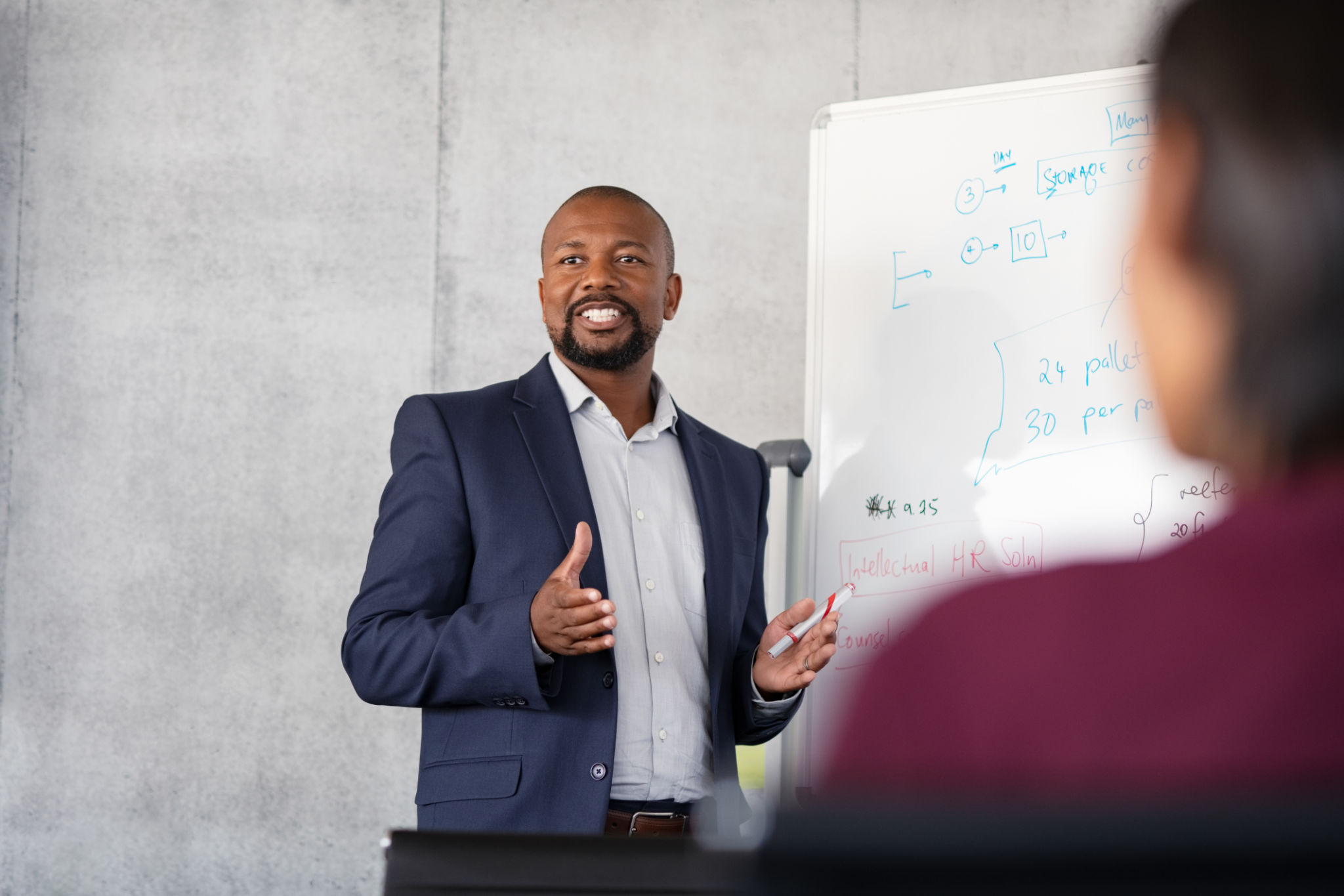 Mature african businessman training employees Mature african businessman training employees