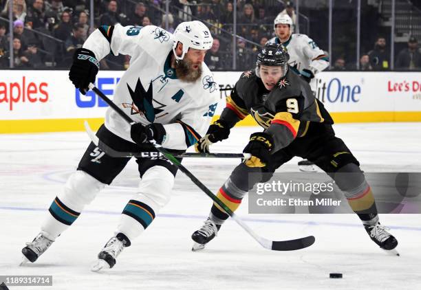 Joe Thornton of the San Jose Sharks skates with the puck against Cody Glass of the Vegas Golden Knights in the first period of their game at T-Mobile...