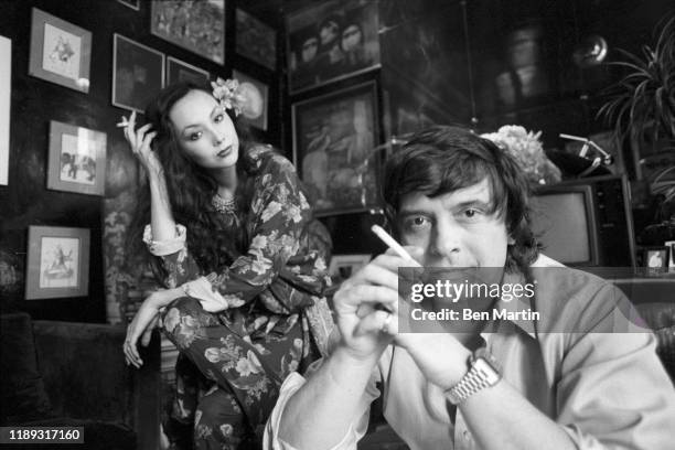 Photographer David Bailey and wife, model Marie Helvin, at home in London, August 18th, 1977.