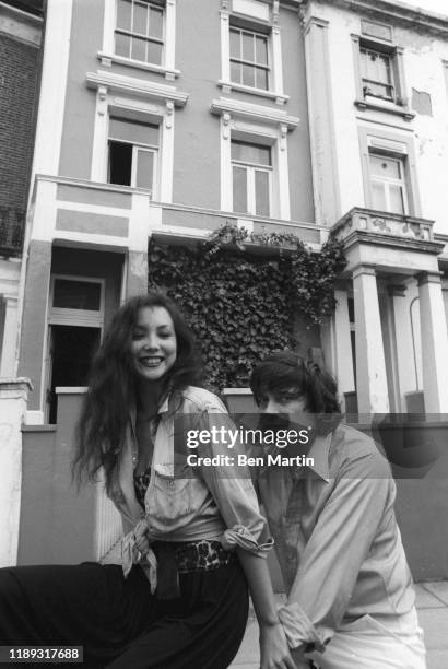 David Bailey and Marie Helvin on a bicycle in front of their London home August 18th, 1977.