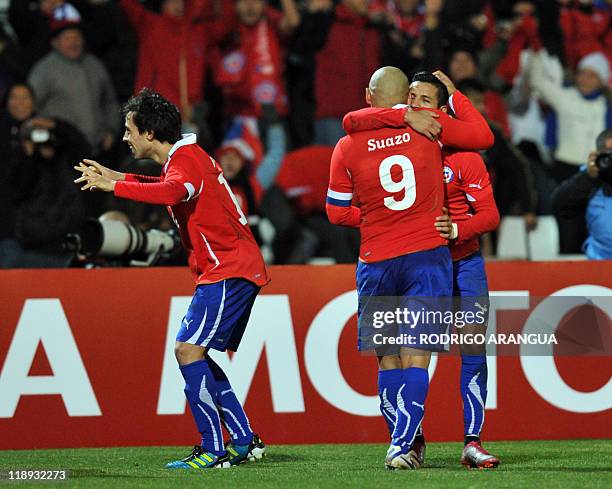 Chilean footballers celebrate at the end of a 2011 Copa America Group C first round football match against Peru, at the Malvinas Argentinas stadium...