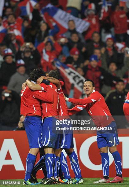 Chilean player Alexis Sanchez celebrates with teammates after defeating Peru during a 2011 Copa America Group C first round football match held at...